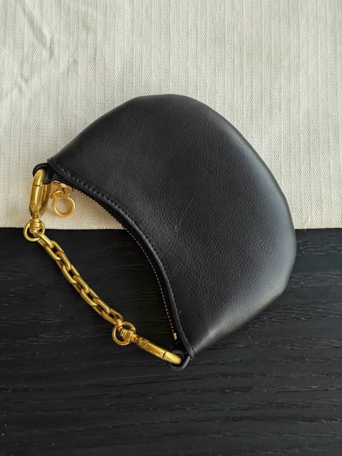 Black Cres mini genuine leather crescent pouch with gold-tone chain